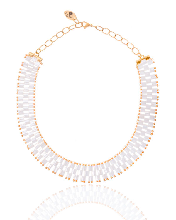 Miyuki Necklace in antique ivory pearl tones with gold accents on a white background